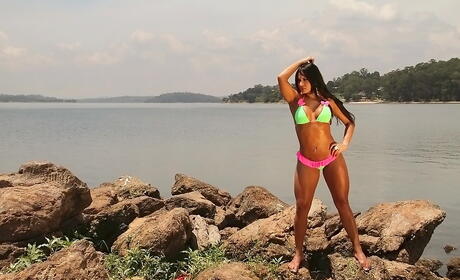 Facinating latin babe Leticia in fancy bikini baring big titties and sexy butt at beach